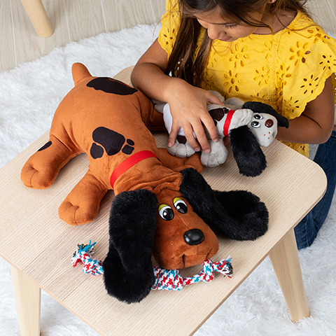 Girl playing with Pound Puppies