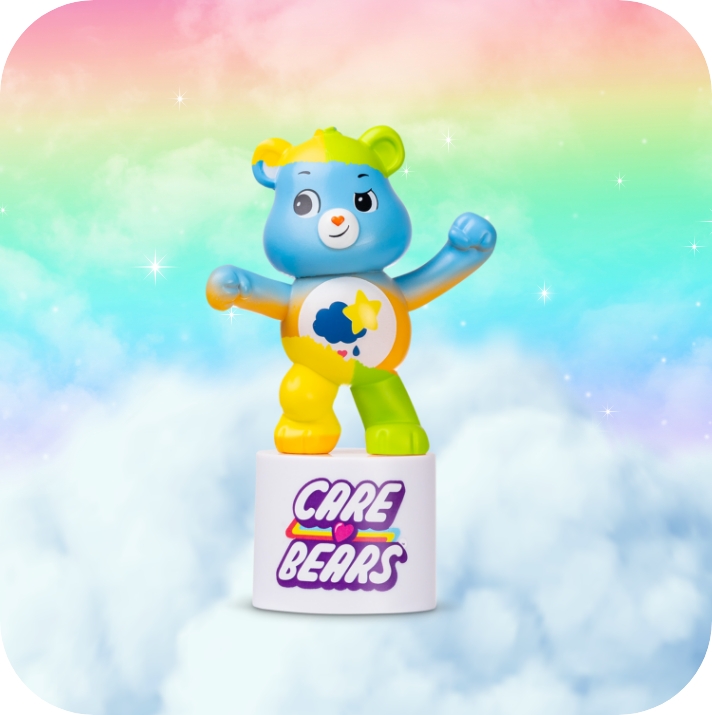 Care Bears peel and reveal. Grumpy on clouds and a rainbow in the background