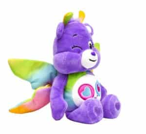 A purple Share Bear plush toy from the Care Bears collection is shown against a plain white background.