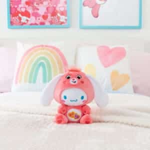 Care Bears Funsize Cinnamoroll plush displayed in a lifestyle setting, featuring a cute and cuddly design with a pink heart emblem on its stomach, promoting love and friendship.