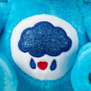 Close up of stomach of Grumpy Bear, highlighting raining cloud emblem.